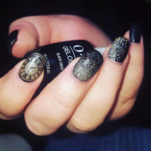 Photo of black nails with clock accent and glitter