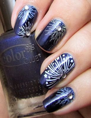 Photo of navy blue nails with white fireworks and stars