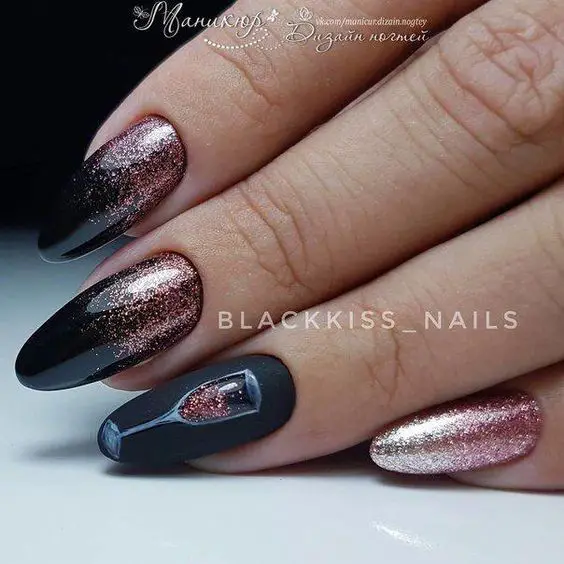 Photo of black nails with rose gold accent glitter and champagne glass for new years nail art designs 2020