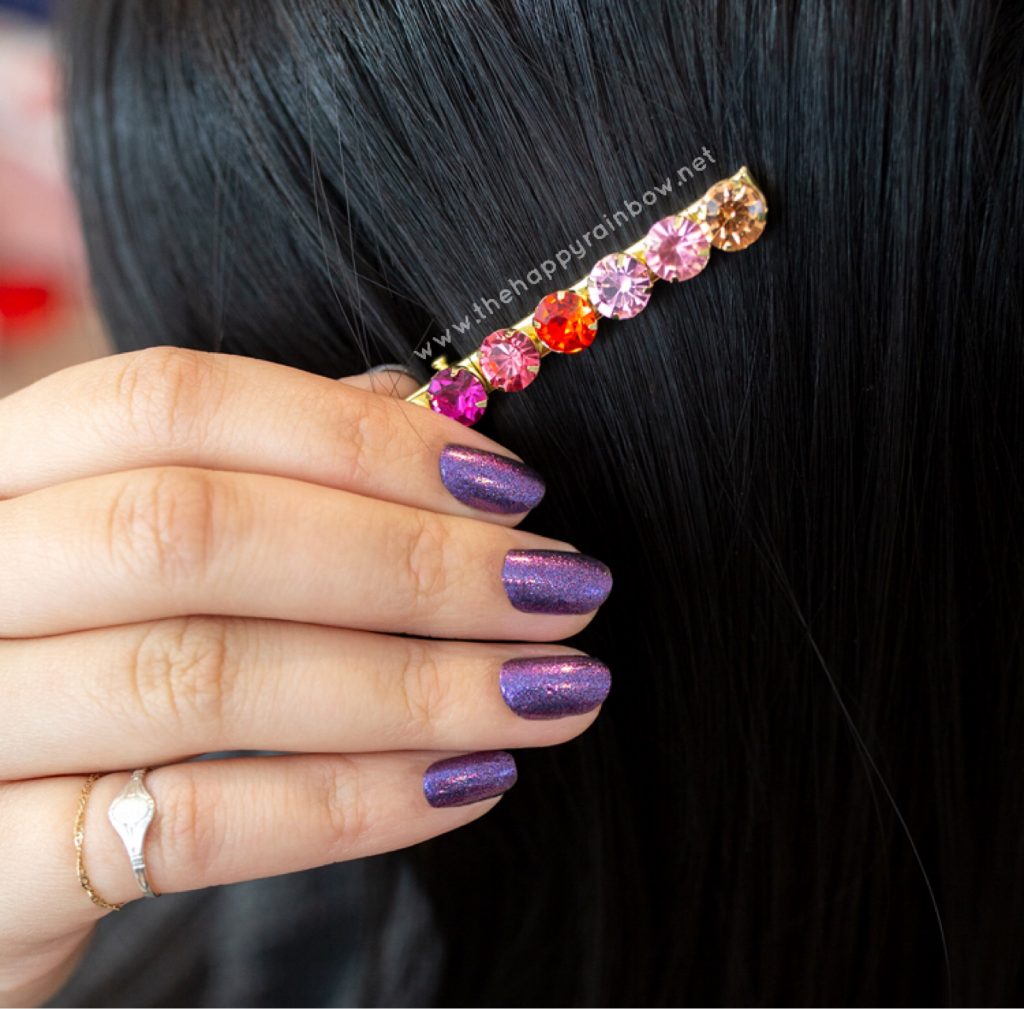 Image of Cosmic Cloud Color Street on real nails with hair clip.