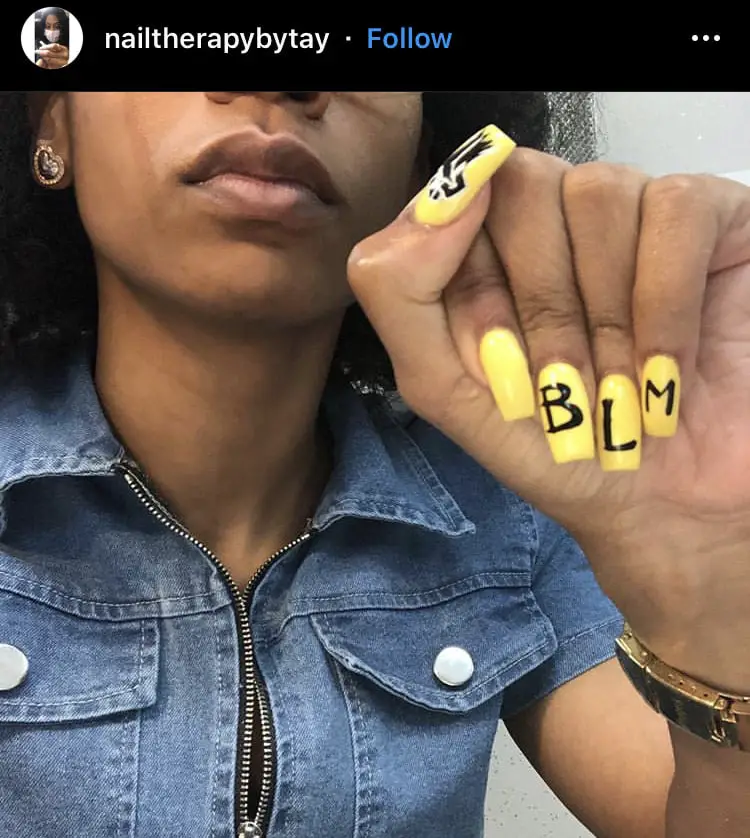 Photo of yellow black lives matter nail art