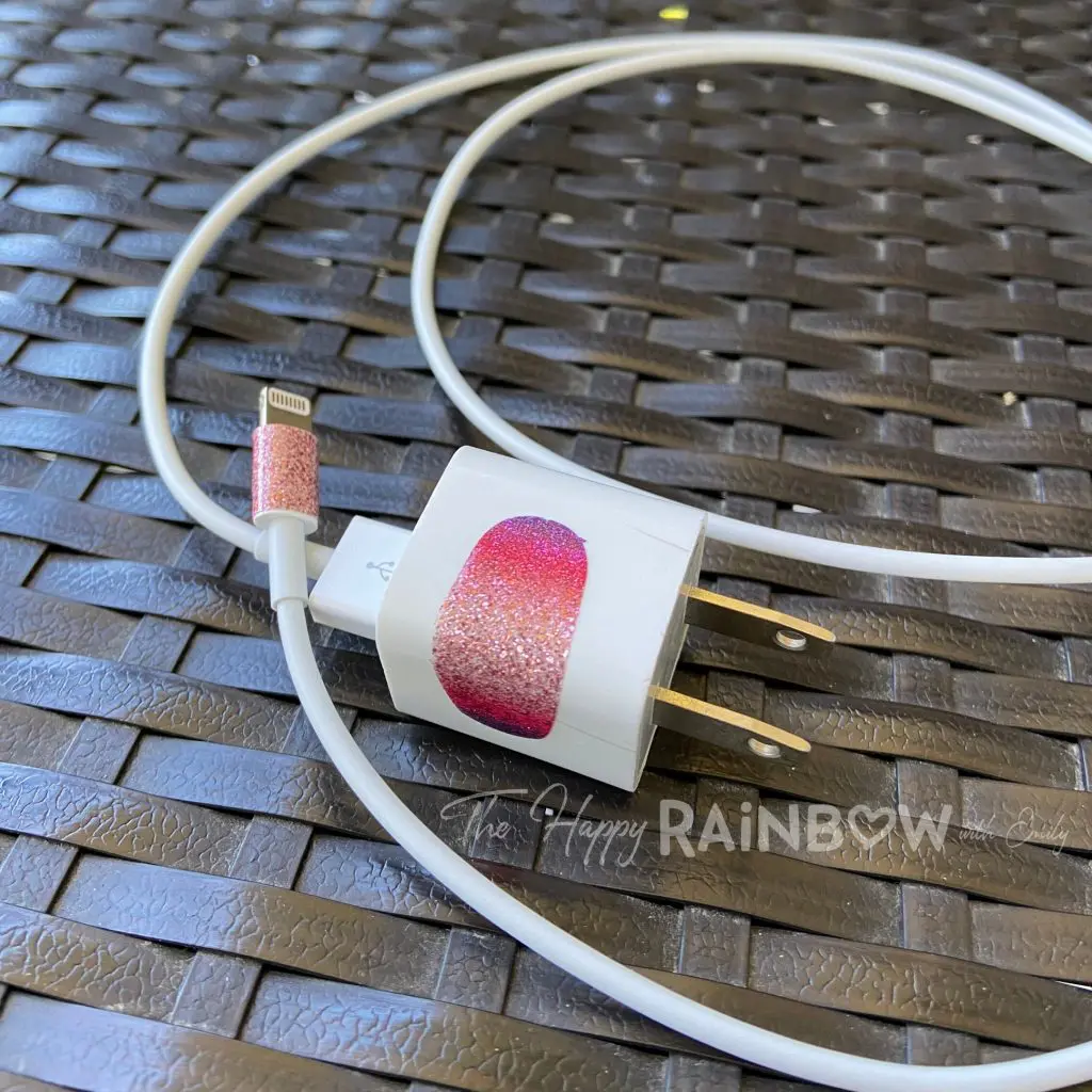 Image of iPhone charger with old nail polish strips on them