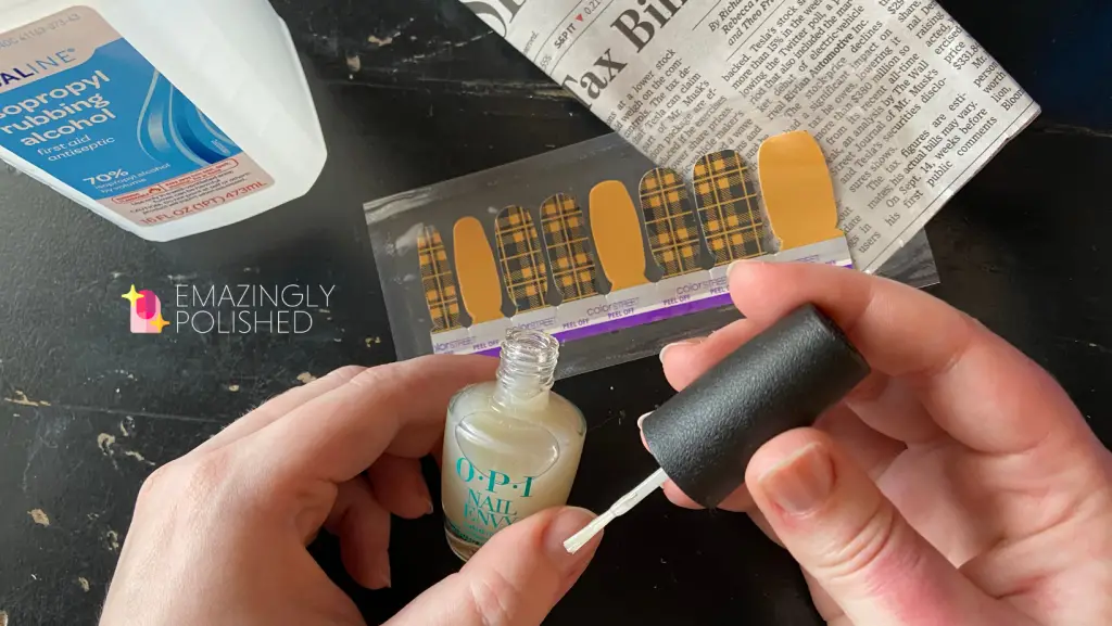 step one is to apply a base coat for newspaper nail art with Color Street